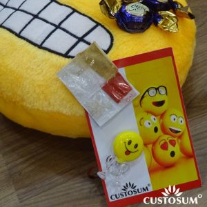 Alternative view of Smiley Rakhi inclusive of Tilak-Chandan-Chawal-Mishri and additional Chocolates.